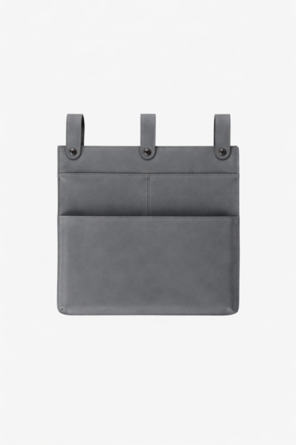 Gray leather wall pocket organizer with three hanging tabs on a light background.