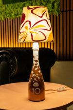 Handcrafted Poretti bottle lamp – lit up warm glow