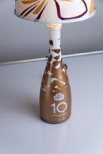 Handcrafted Poretti bottle lamp – on wooden surface