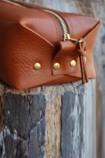 dark brown leather toiletry bag side view