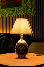 Handcrafted Vecchia Romagna bottle lamp – lit up warm glow