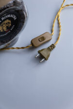 Handcrafted Vecchia Romagna bottle lamp – on wooden surface