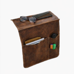 Brown leather wall pocket organizer holding glasses, mail, and small accessories on a light background.