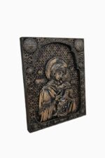 Virgin Mary holding in her arms the baby Jesus – wood carved icon detail