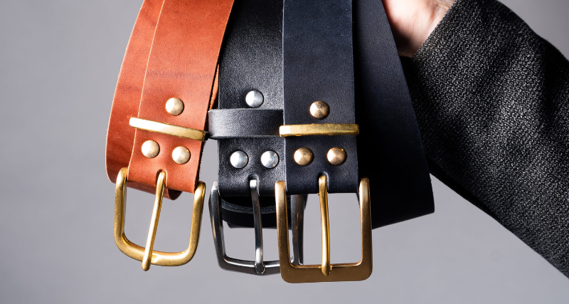 Handcrafted full-grain leather belts with brass and silver buckles