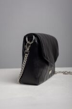 Side view of the black quilted leather chain shoulder bag