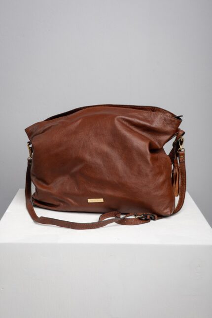 Brown leather slouch shoulder bag front view with adjustable strap
