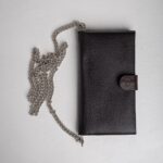 Dark brown leather wallet on chain front view with snap tab closure