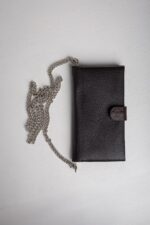 Dark brown leather wallet on chain front view with snap tab closure