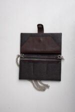 Dark brown leather wallet on chain opened showing card slots and note section