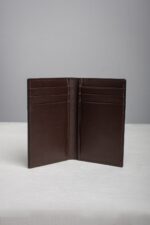 Leather bifold card holder wallet open showing eight card slots