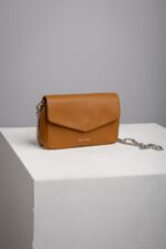 Tan leather chain crossbody bag with envelope flap front view