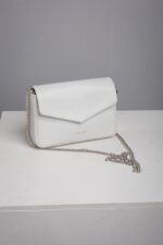 White leather envelope clutch bag with silver chain at an angle