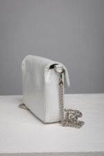 Side view of the white leather chain shoulder bag showing depth