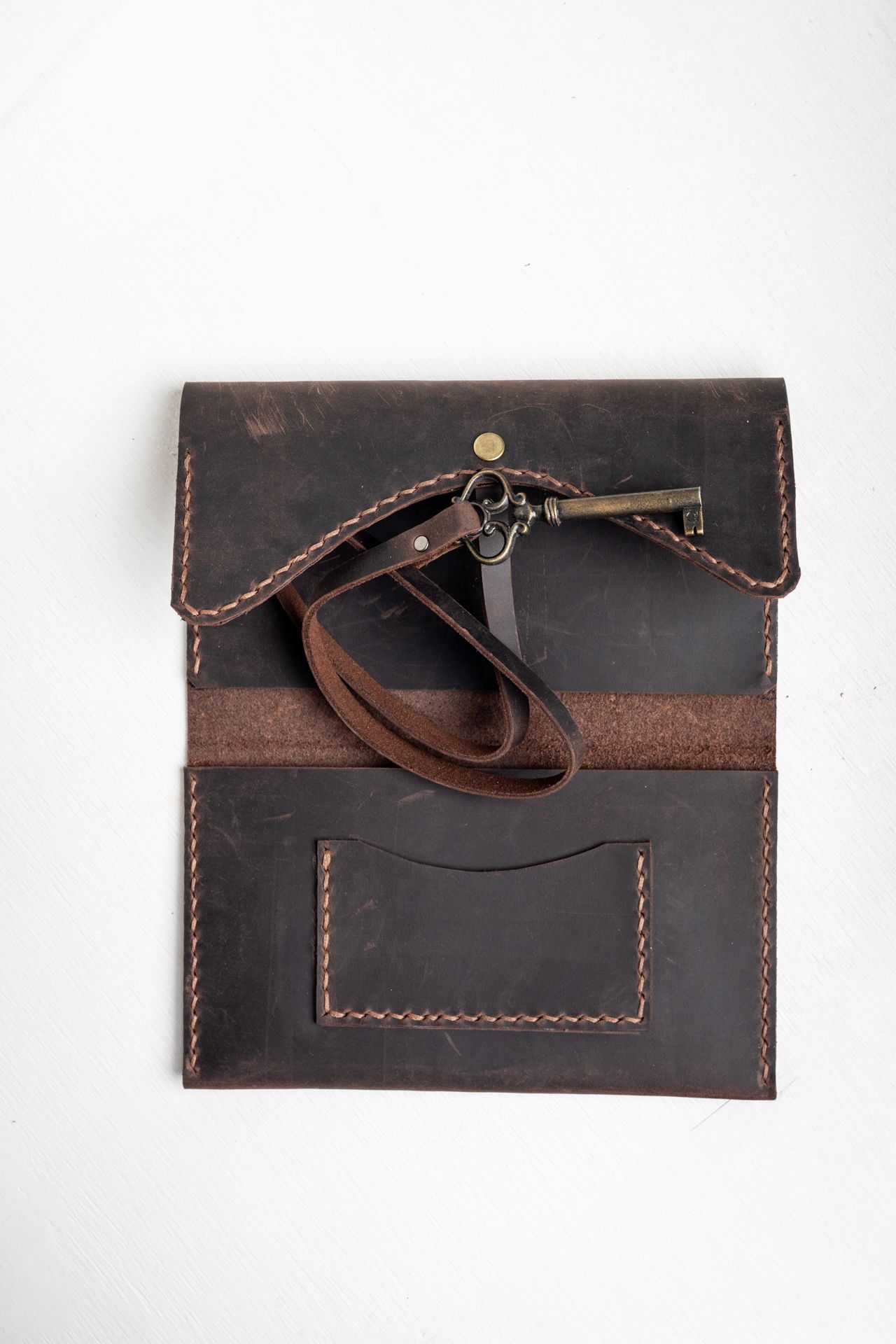 Inside of the vintage brown leather tobacco pouch with card pocket