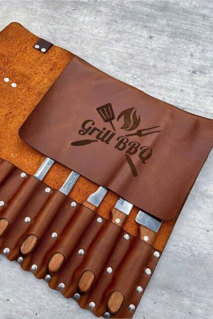 Close-up of leather knife holder 7s slots and buckle detail