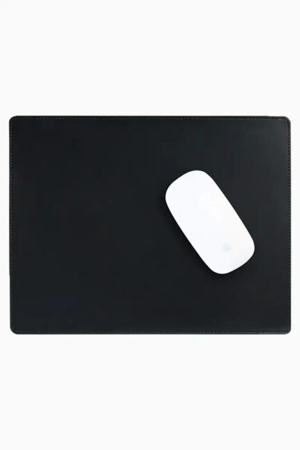 Black leather mouse pad with tone-on-tone perimeter stitching and rounded corners, with a white wireless mouse placed on the right side, top-down view on a white background.