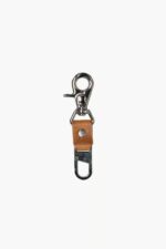 Leather Tow Anchor Vintage attached to a camera strap for keeping the camera close to the body, lifestyle close-up